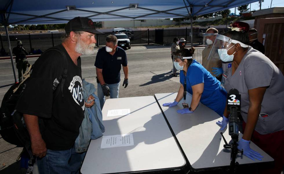 Patrick Bailey, 59, is screened by Southern Nevada Health District Community Health Nurse Tashe ...