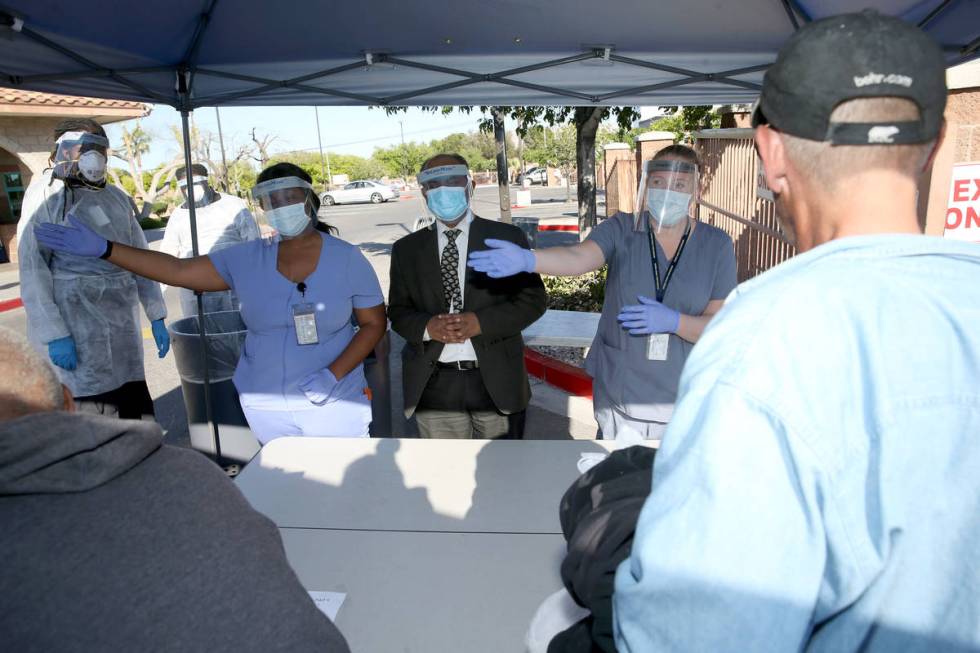 Southern Nevada Health District Community Health Nurse Chika McTier, from left, Dr. Praveen Sar ...