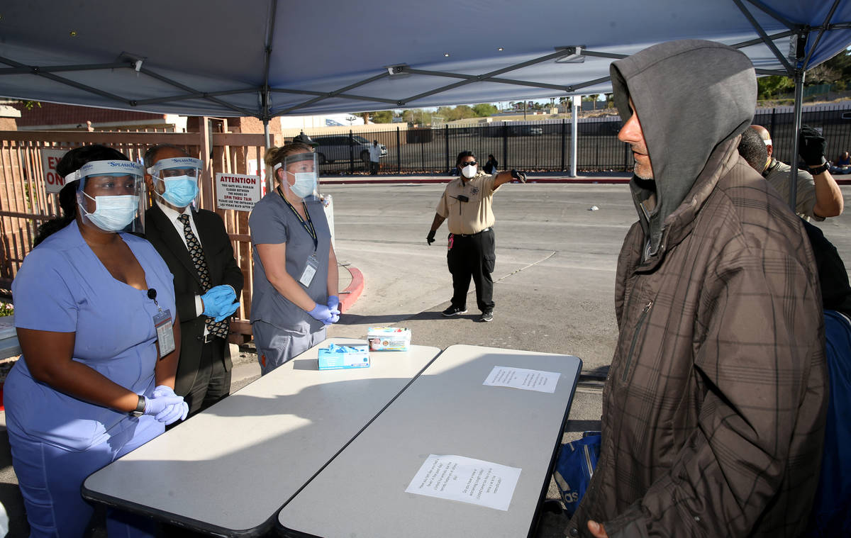 Southern Nevada Health District Community Health Nurse Chika McTier, from left, Dr. Praveen Sar ...