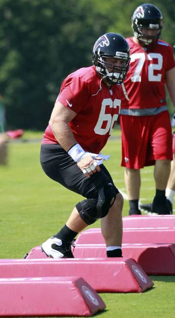 Atlanta Falcons center Joe Hawley runs through a drill during NFL football training camp in Flo ...