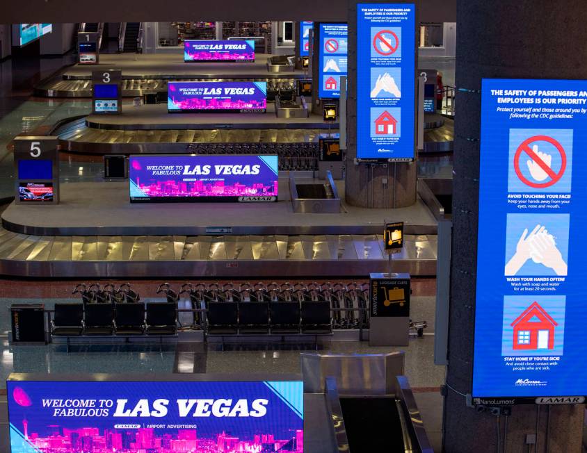 Baggage carousels sit unused at McCarran International Airport on Wednesday, April 1, 2020, in ...