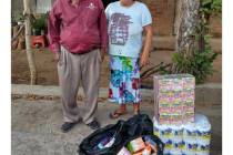 Jose "Chepito", a street vendor in El Salvador, and an unidentified woman are shown with grocer ...