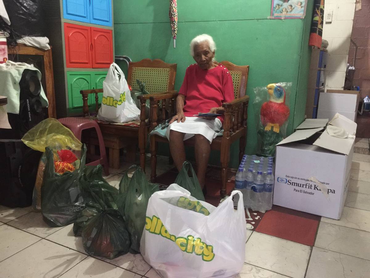 Maria Luisa, 98, is shown with groceries purchased by Lights FC soccer player Junior Burgos dur ...