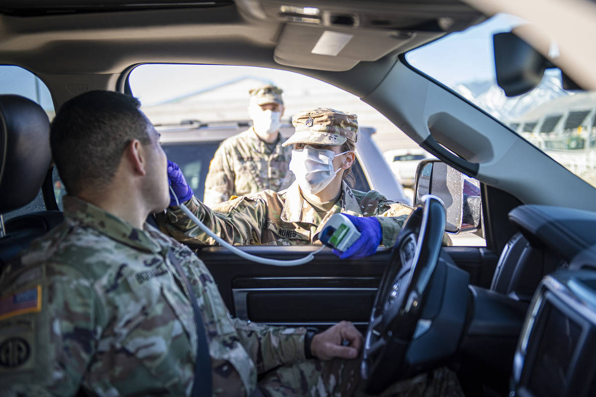 National Guard/Sgt. Walter H. Lowell Staff Sgt. Jennifer Nunes, a health care specialist assig ...