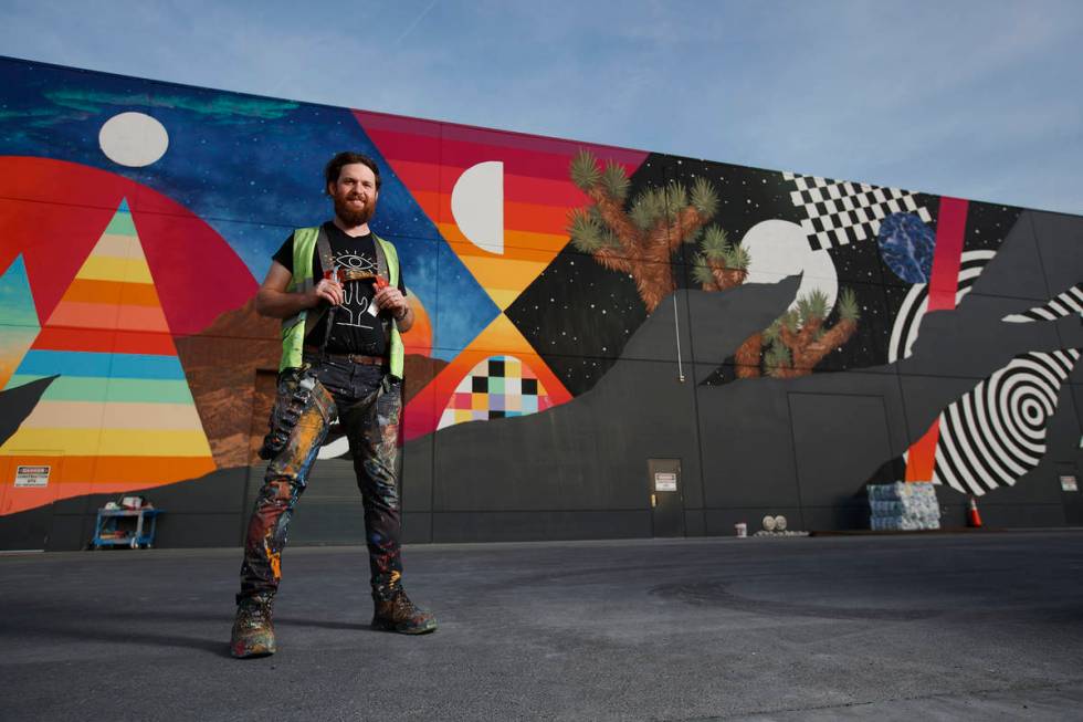 Eric Vozzola and his mural at Area 15 in Las Vegas. ( Kate Russell, Courtesy of Meow Wolf)