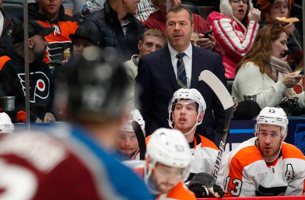 Philadelphia Flyers head coach Alain Vigneault looks on from the team box in the second period ...