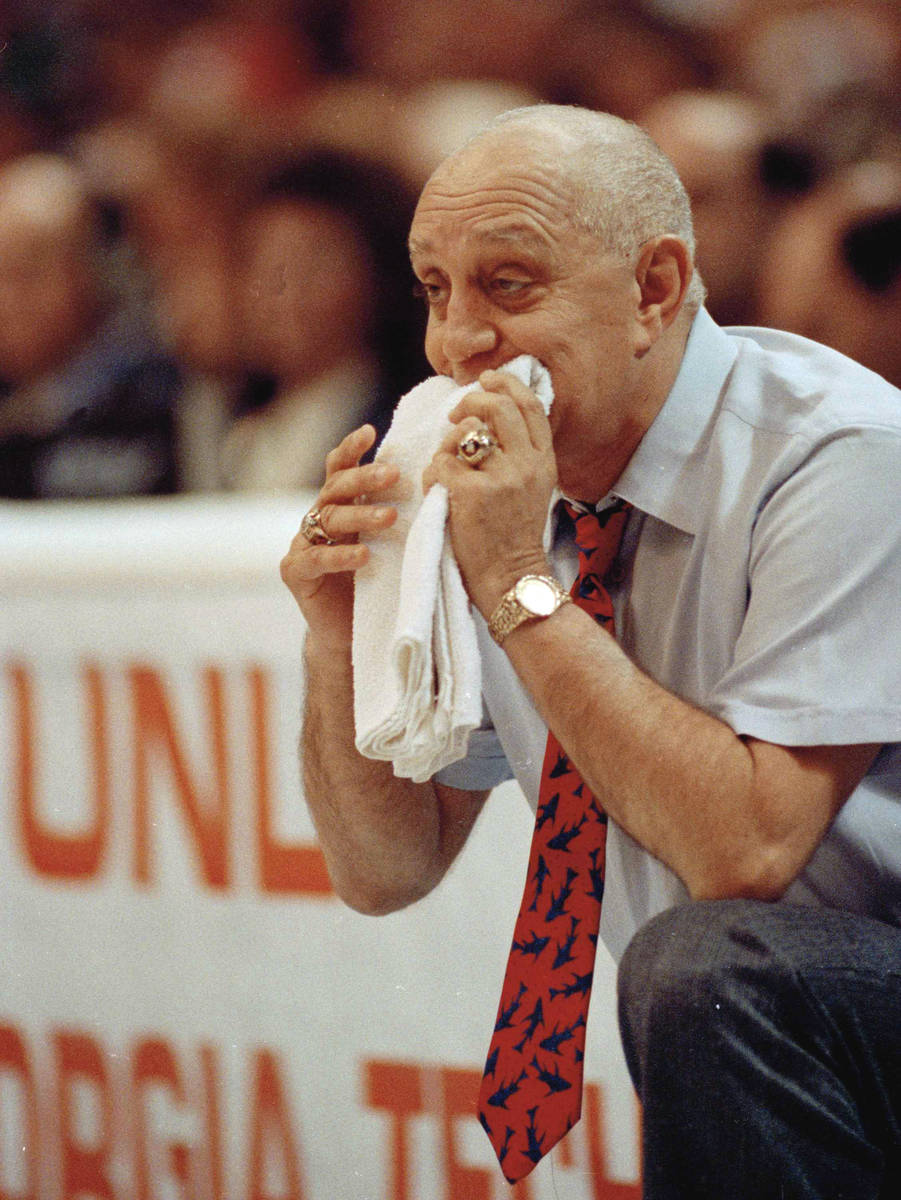 In this April 2, 1990, file photo, UNLV coach Jerry Tarkanian chews on his towel while watching ...