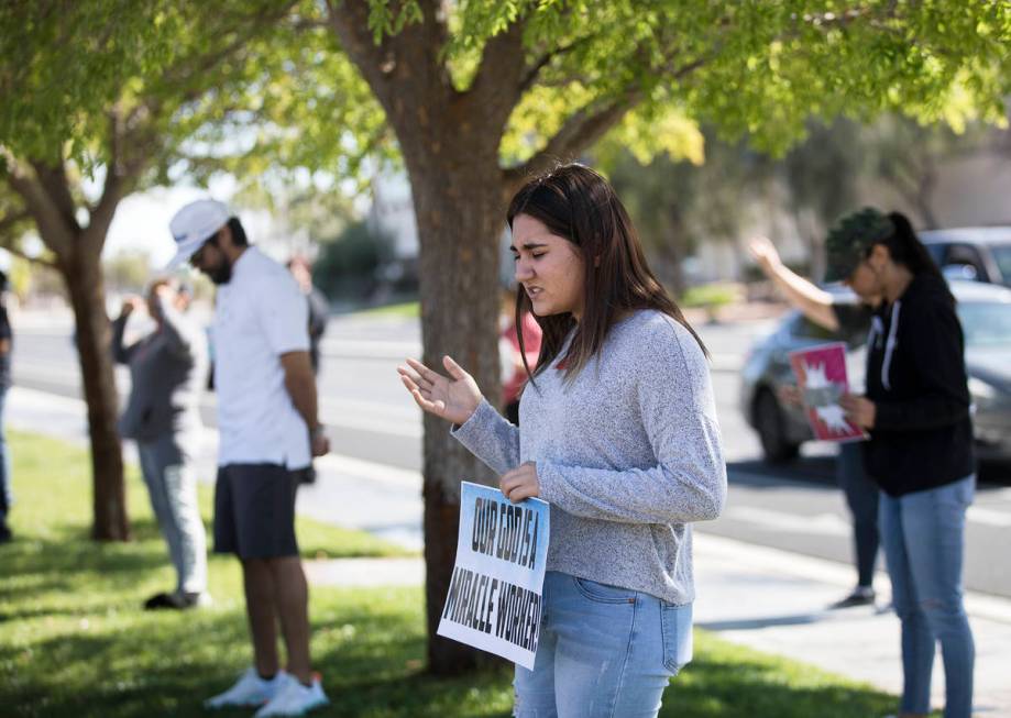 Dariahne Navarro, 16, center, prays with family and friends for her cousin Adriana Huh who is i ...