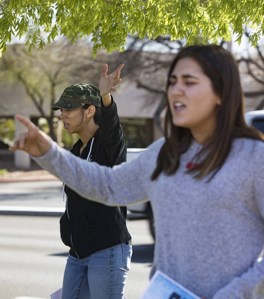 Crystal Espinoza, left, and Dariahne Navarro, 16, right, pray with family and friends for Adria ...