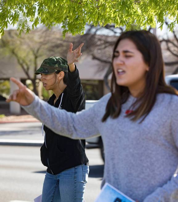 Crystal Espinoza, left, and Dariahne Navarro, 16, right, pray with family and friends for Adria ...