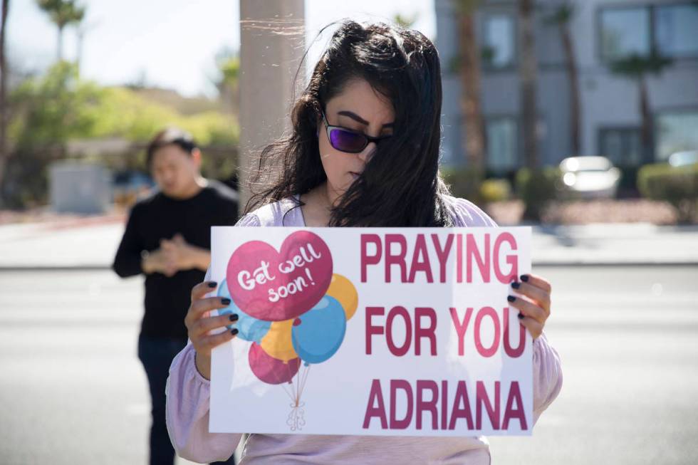 Stephanie Romero prays with family and friends for her cousin Adriana Huh who is in the hospita ...