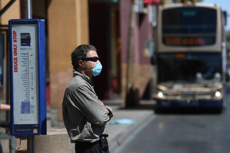 George, who declined to give his last name, waits for the bus after his shift as a security gua ...