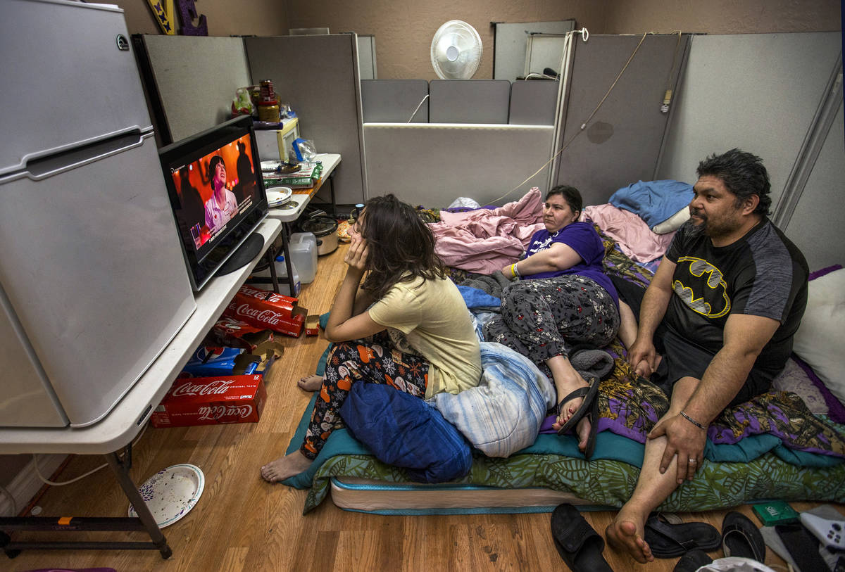 Aubrie Heenan, 17, left, watches Hulu with her parents Stephanie Hedge and Jeremy Ferreira in t ...