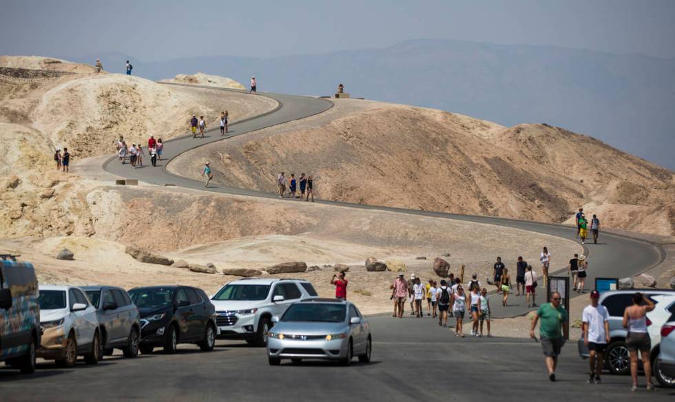 This Aug. 7, 2018, file photo shows visitors at Zabriskie Point in Death Valley National Park, ...