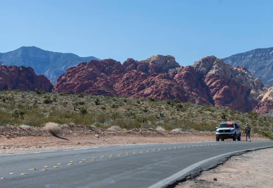 A Metro officer blocks off Calico Basin Road near Red Rock Canyon National Conservation Area on ...