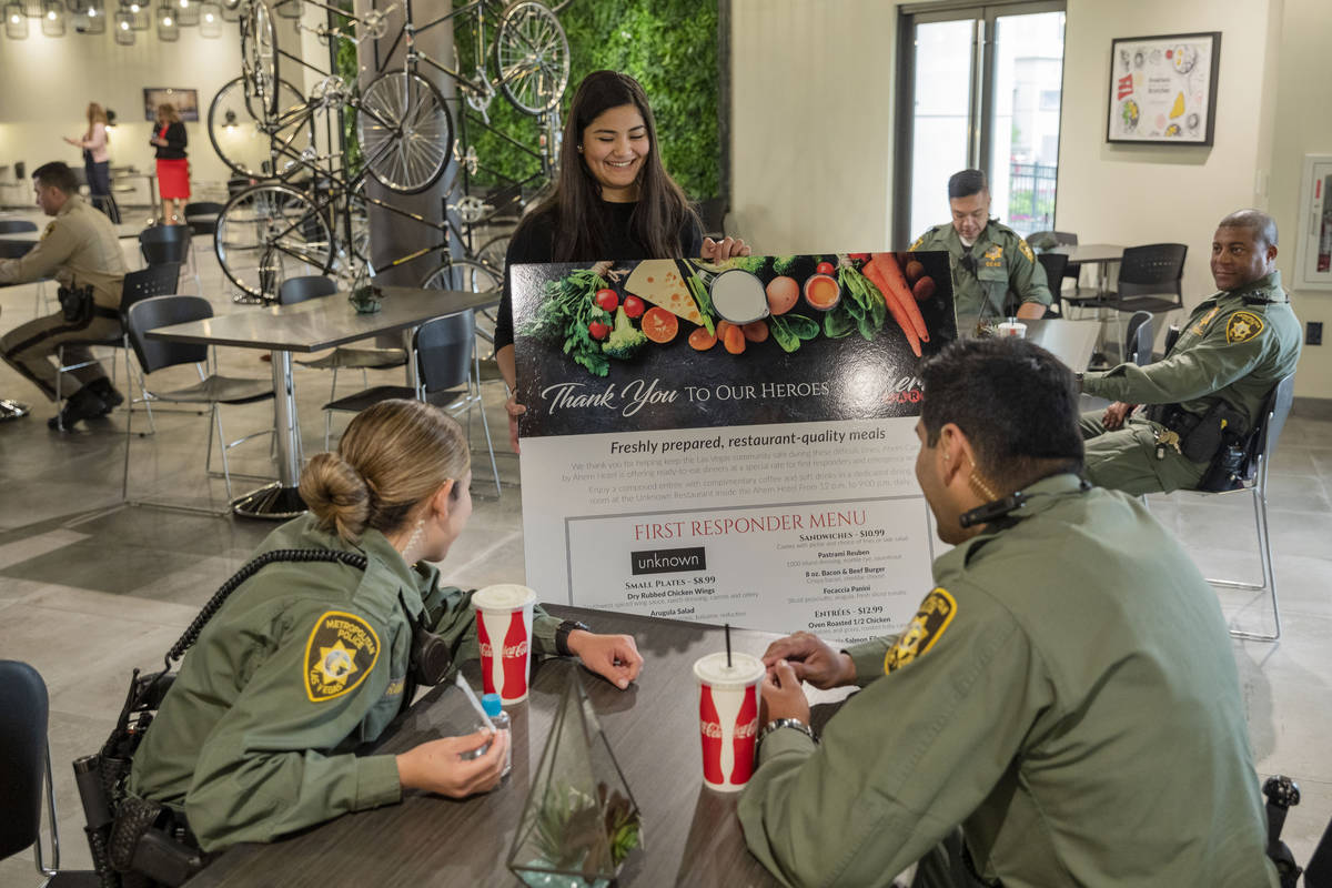 Officers of the Las Vegas Metropolitan Police Department order meals at Unknown restaurant at A ...