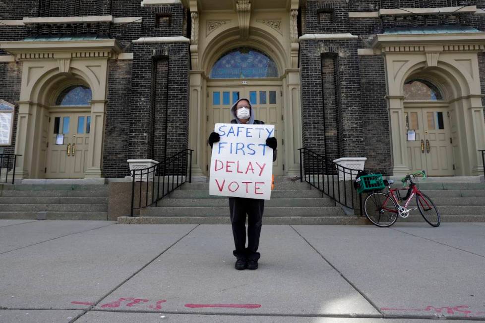 Jim Carpenter protests Tuesday's scheduled election amid the coronavirus pandemic Monday April ...