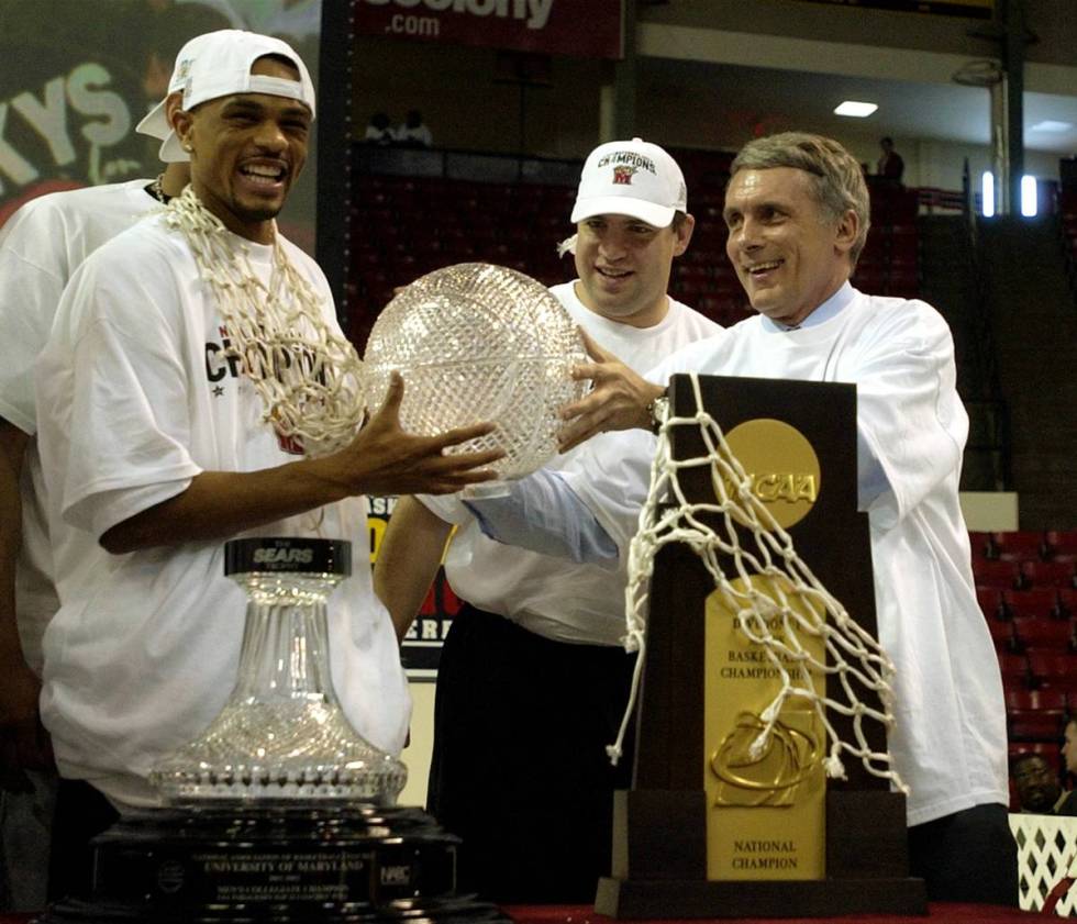 FILE - In this file photo taken April 2, 2002, Maryland basketball player Juan Dixon, left, jok ...