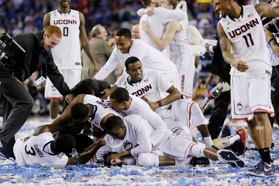 Connecticut celebrates after winning the NCAA Final Four tournament college basketball champion ...