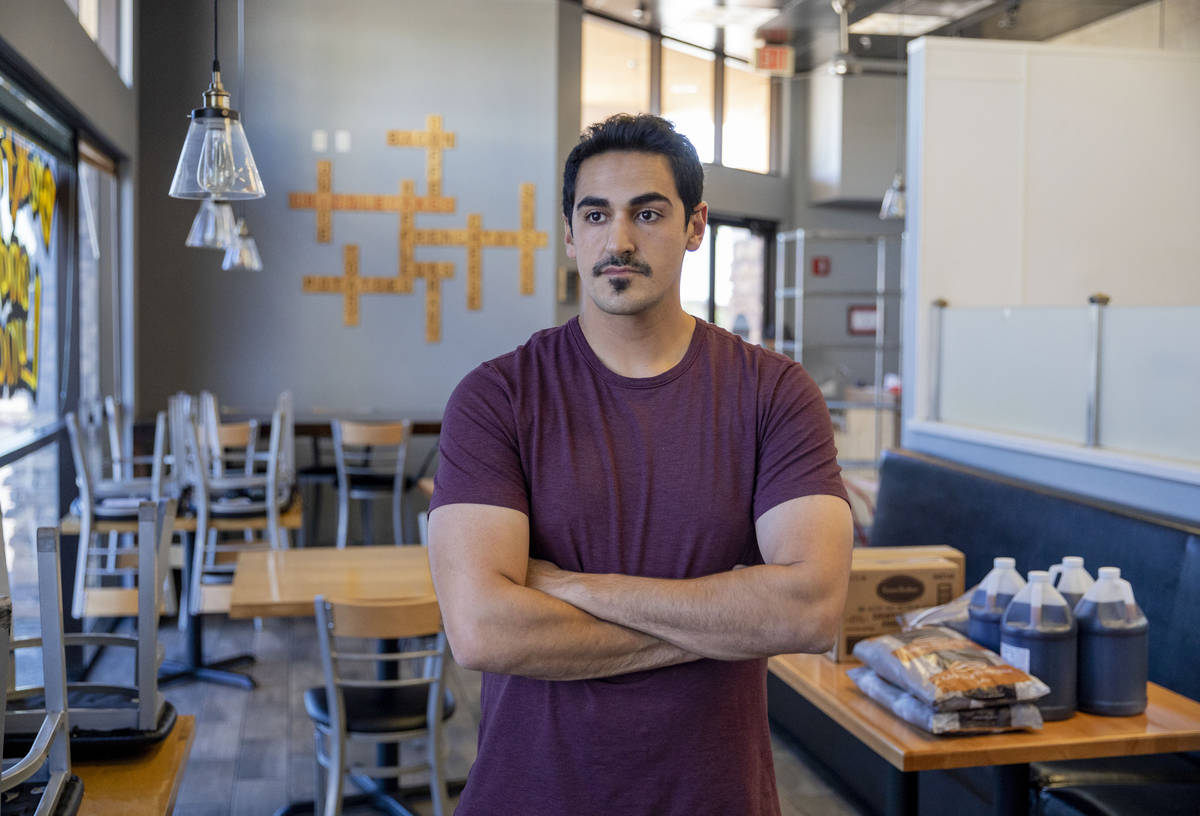 Hamed Emamzadeh, owner of Griddlecakes on S Fort Apache Road, is photographed in his restaurant ...