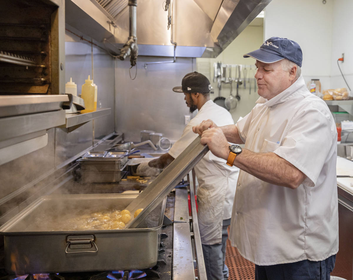 Cook Sheldon Holgate, left, and Michael Weiss, chef and owner of Weiss Deli and Bakery, make ma ...