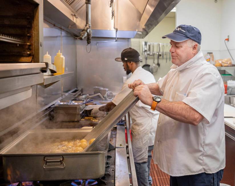 Cook Sheldon Holgate, left, and Michael Weiss, chef and owner of Weiss Deli and Bakery, make ma ...