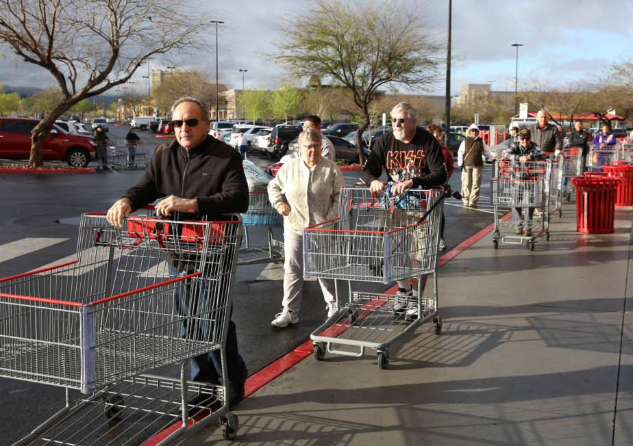 Seniors line up outside Costco on Friday, March 20, 2020, in Henderson. The store reserved earl ...