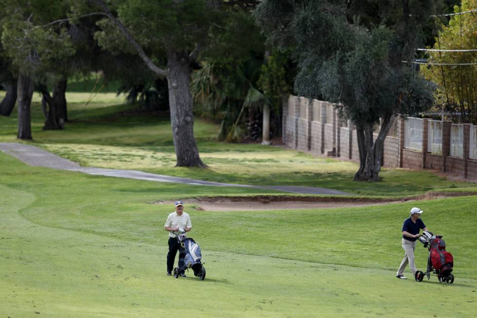 Golfers at Las Vegas National Golf Club Wednesday, April 8, 2020. Golf courses have closed club ...