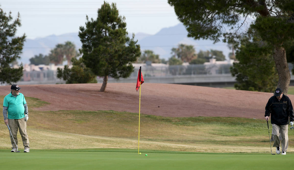 Golfers at The Club at Sunrise in Las Vegas Wednesday, April 8, 2020. Golf courses have closed ...