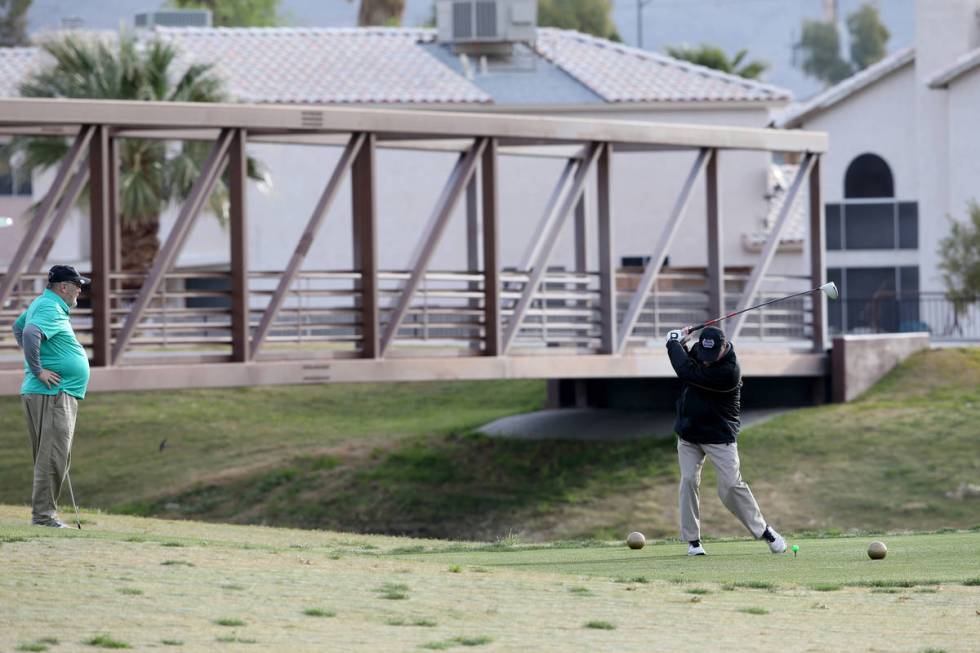 Golfers at The Club at Sunrise in Las Vegas Wednesday, April 8, 2020. Golf courses have closed ...