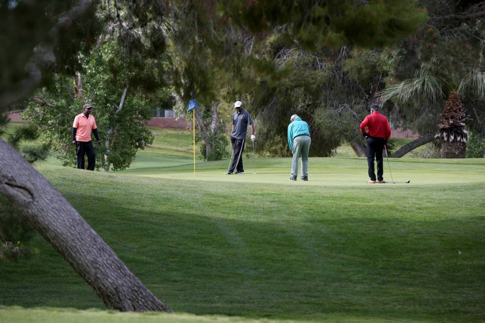 Golfers at Las Vegas National Golf Club Wednesday, April 8, 2020. Golf courses have closed club ...