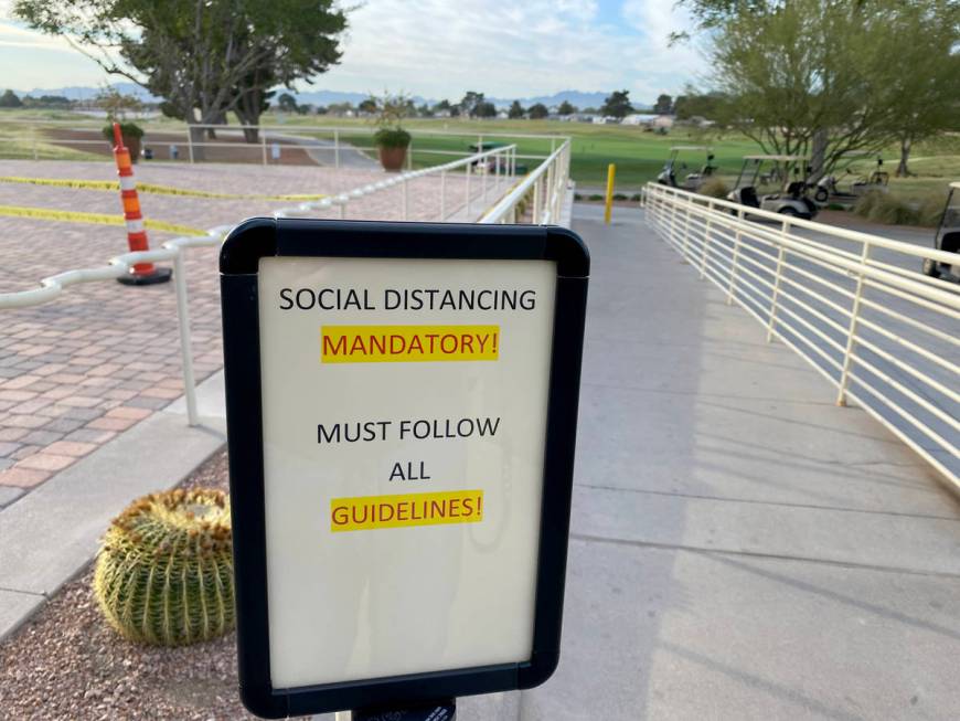 A social distancing sign at The Club at Sunrise golf course in Las Vegas Wednesday, April 8, 20 ...