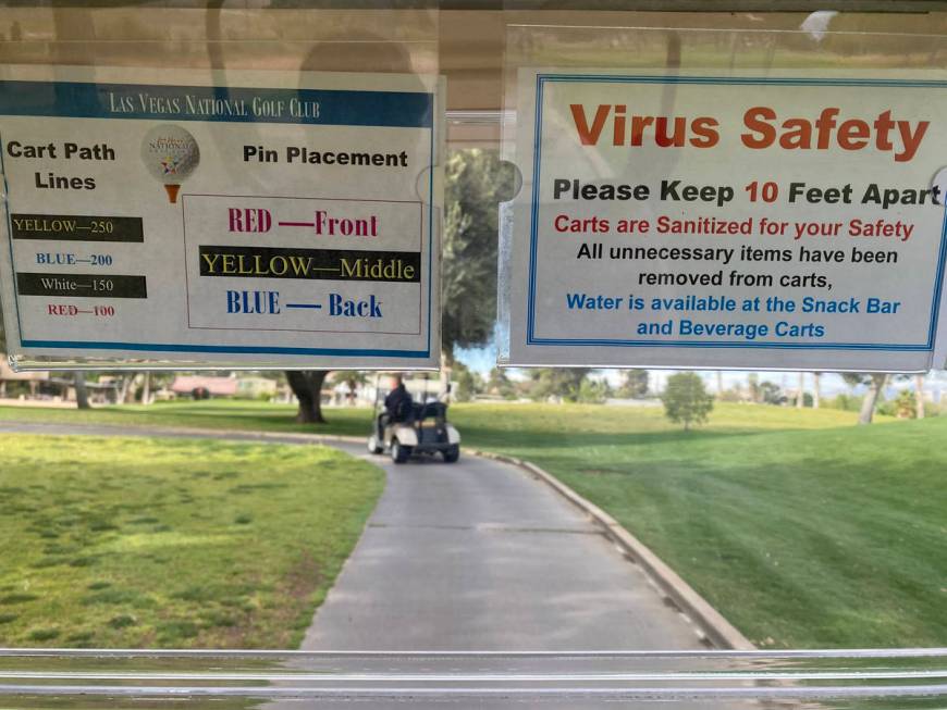 A social distancing sign in a golf cart at Las Vegas National Golf Club Wednesday, April 8, 202 ...