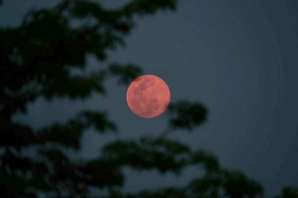 A view of the 'super pink moon', in Naypyitaw, Myanmar, Tuesday, April 7, 2020. (AP Photo/Aung ...