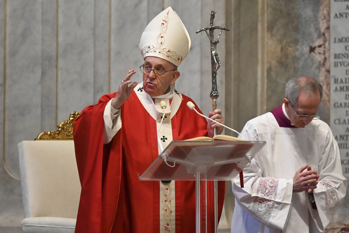 Pope Francis celebrates Palm Sunday Mass behind closed doors in St. Peter's Basilica, at the Va ...