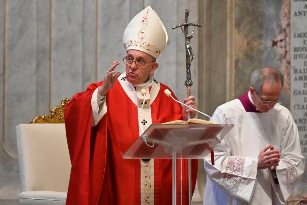 Pope Francis celebrates Palm Sunday Mass behind closed doors in St. Peter's Basilica, at the Va ...