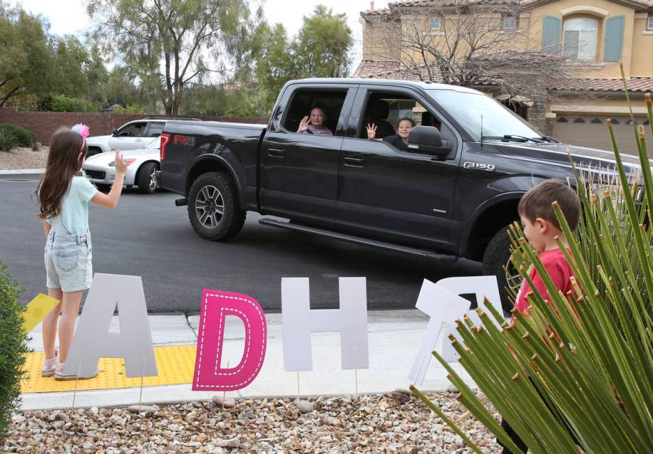 Tenley Hynds, right, waves to her friends and cousins who came to celebrate her 8th birthday wh ...