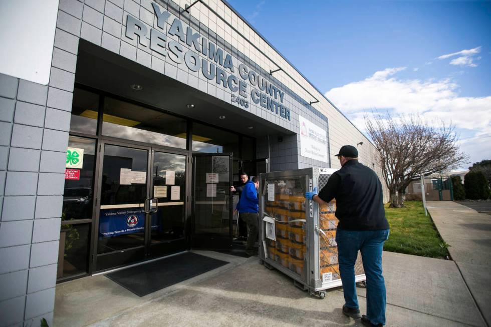 Horace Ward, right, operations manager of Yakima Valley Office of Emergency Management, right, ...