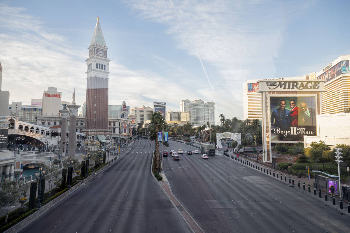 A few cars drive on Las Vegas Blvd., through the Las Vegas Strip on Monday morning, March 16, 2 ...