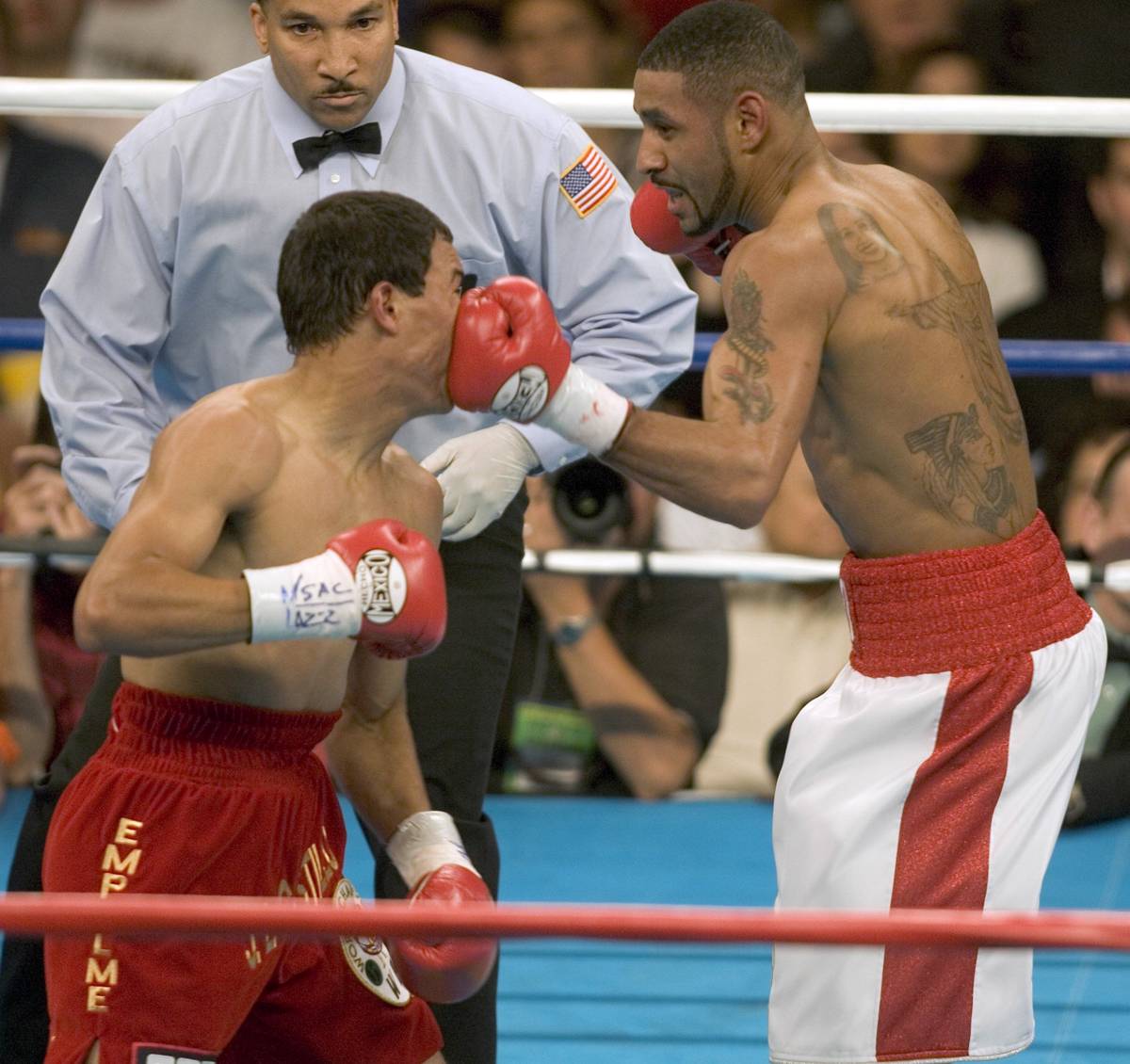 Diego Corrales lands a left to Jose Luis Castillo in the 1st round of their WBA/WBO lightweight ...