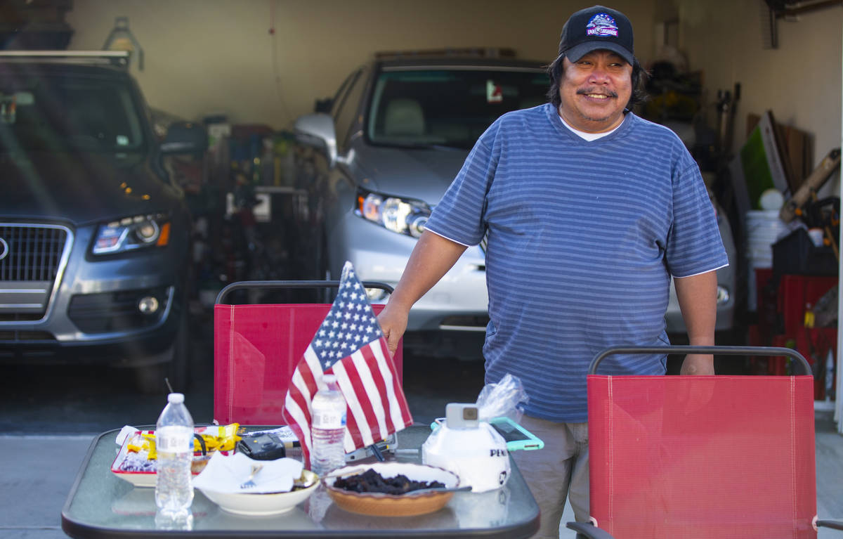 Noel Eusebio enjoys the weather outside of his home while participating in a neighborhood front ...