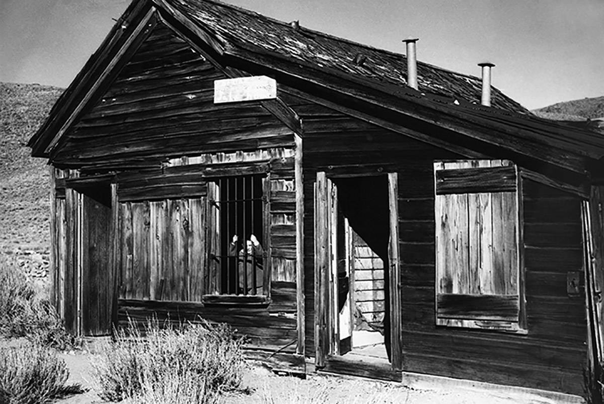 The only child in the gold mining ghost town, Jack Evans Jr., 7, plays in the old jail in Bodie ...