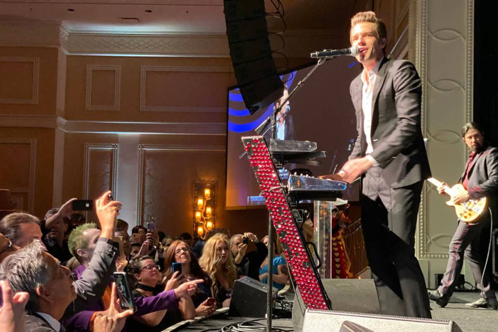 Brandon Flowers, left, and Ted Sablay of The Killers perform at The Neon Museum's annual Boneya ...