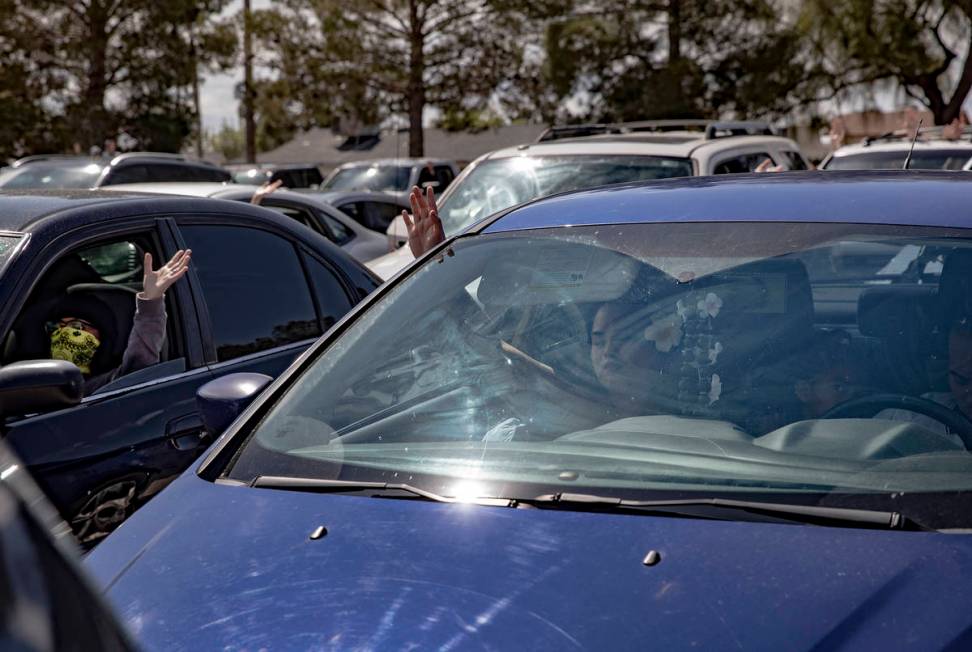 Guests attend an Easter service in the parking lot at International Church of Las Vegas in Las ...