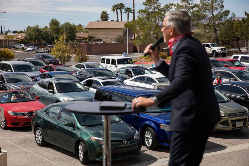 Pastor Paul Marc Goulet leads an Easter service in the parking lot at International Church of L ...