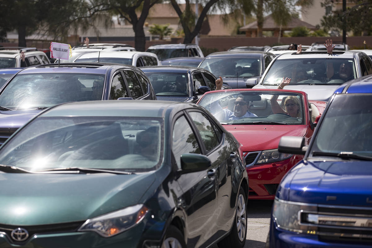 Guests attend an Easter service in the parking lot at International Church of Las Vegas in Las ...