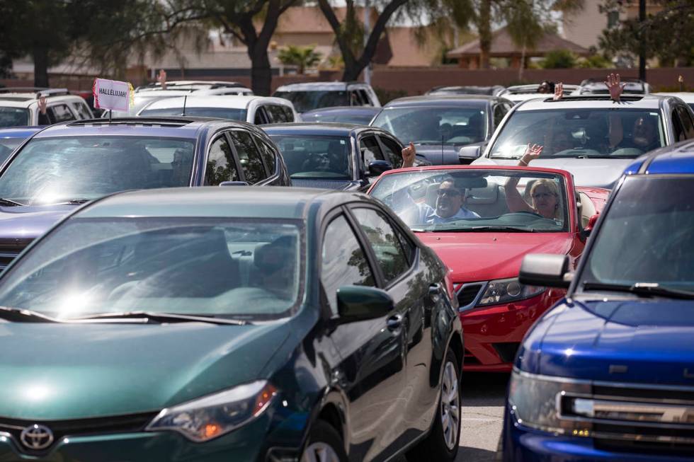 Guests attend an Easter service in the parking lot at International Church of Las Vegas in Las ...