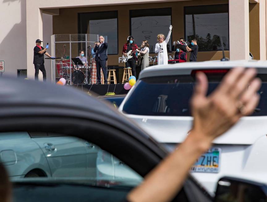 Guests attend an Easter service in the parking lot at International Church of Las Vegas in Las ...