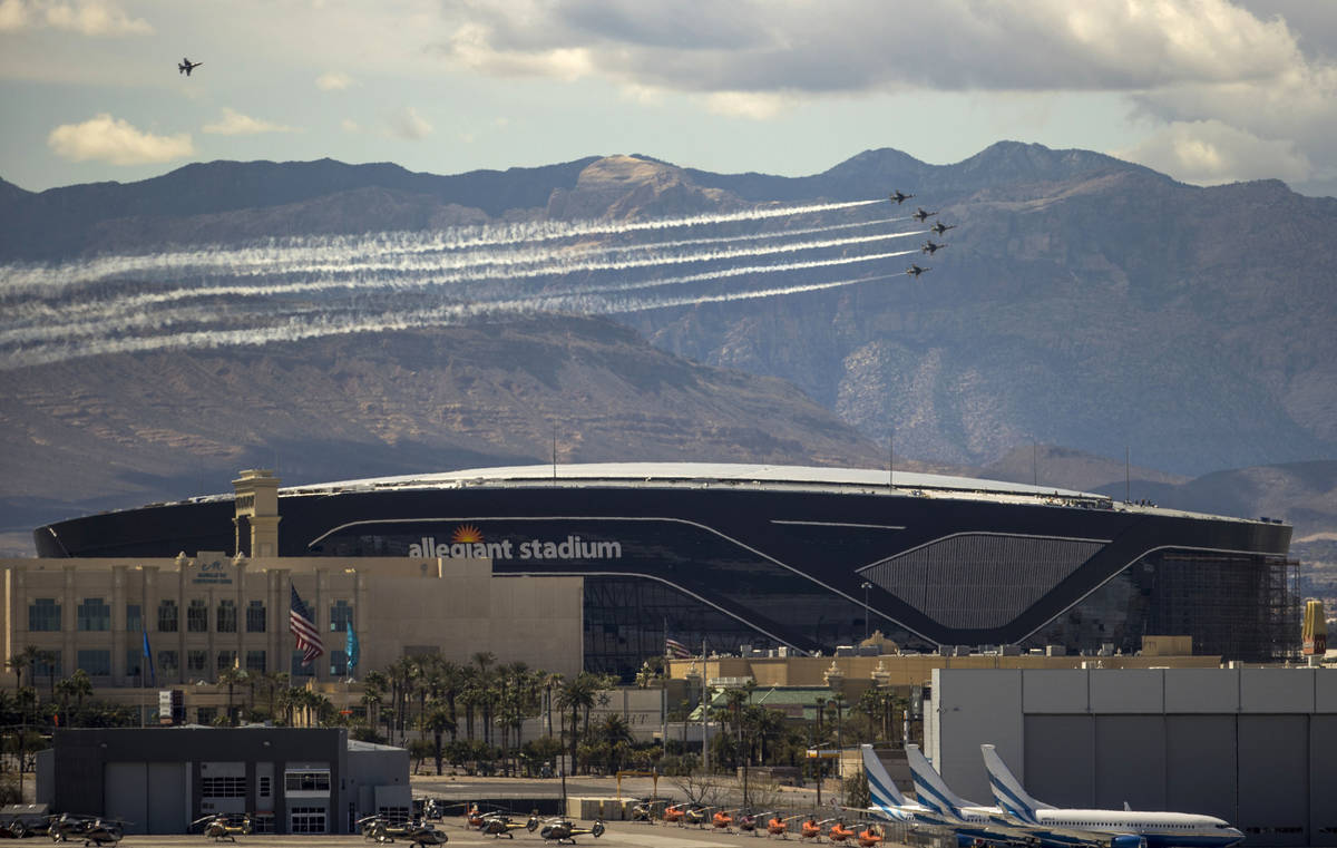 The U.S. Air Force Air Demonstration Squadron, the Thunderbirds, soar past Allegiant Stadium du ...