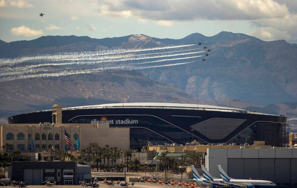 The U.S. Air Force Air Demonstration Squadron, the Thunderbirds, soar past Allegiant Stadium du ...